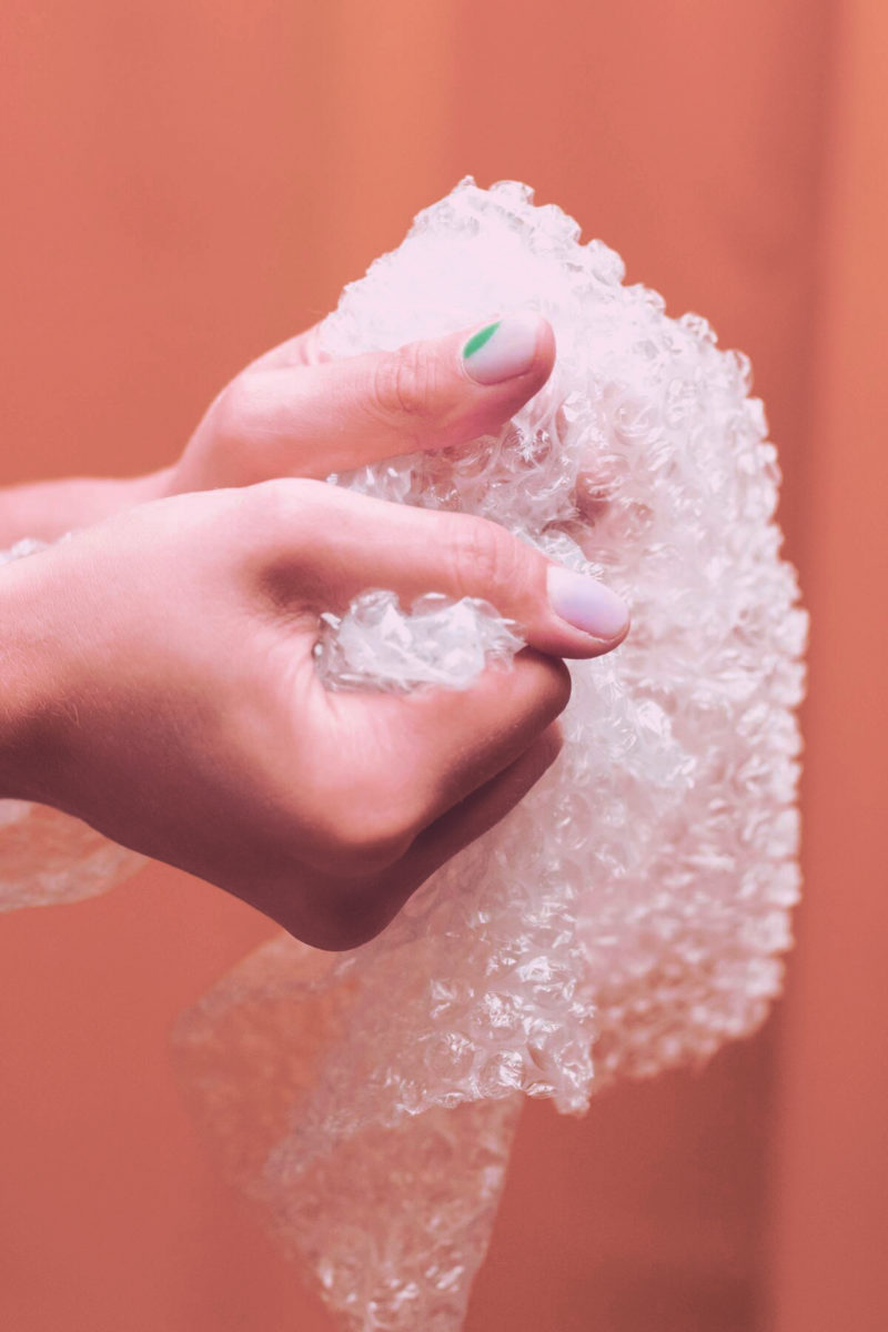 a person holding a bubble wrap